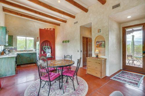 a kitchen and dining room with a table and chairs at Chic Tucson Casita with Deck and Panoramic Views! in Tucson