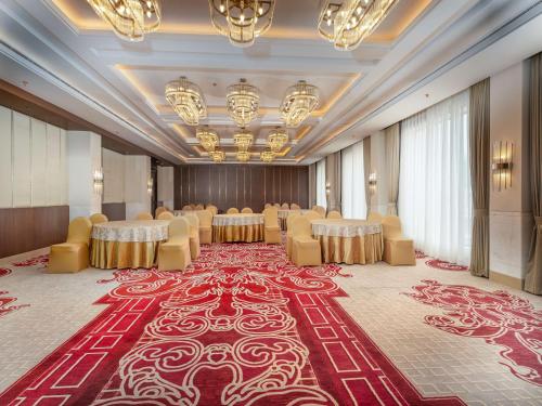 a banquet hall with chairs and tables in a room at Radisson Collection Hotel & Spa, Riverfront Srinagar in Srinagar