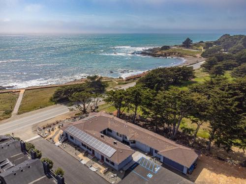 an aerial view of a house and the ocean at Windrush Inn - Cambria in Cambria