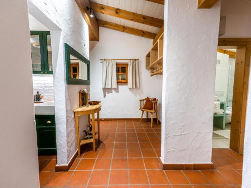 a kitchen with a red tile floor and a counter at Family Hideout in Kitzbühel