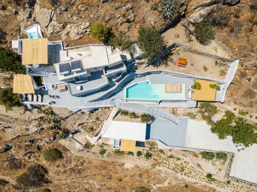 an aerial view of a house with a swimming pool at Eolithos Exclusive Suites in Éxo Goniá