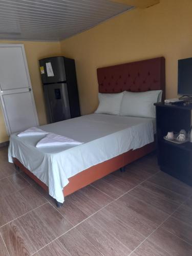 Postel nebo postele na pokoji v ubytování Posada Paradise Suite
