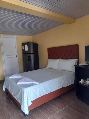 Postel nebo postele na pokoji v ubytování Posada Paradise Suite
