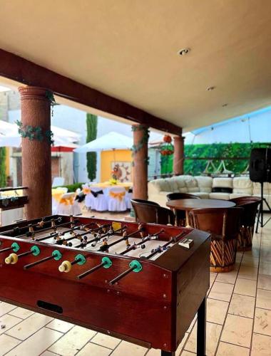 a large pool table sitting on top of a patio at Residencia Mirenick in Cuautlixco