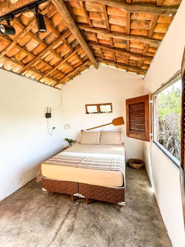 a bedroom with a bed in a room at Refúgio CAJUÍ in Barreirinhas
