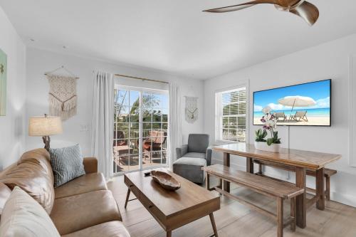 a living room with a couch and a table at Lime Tree Bay Resort in Islamorada