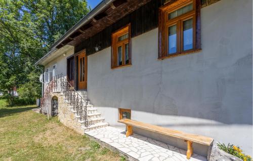 a building with a bench in front of it at 4 Bedroom Nice Home In Begovo Razdolje in Begovo Razdolje