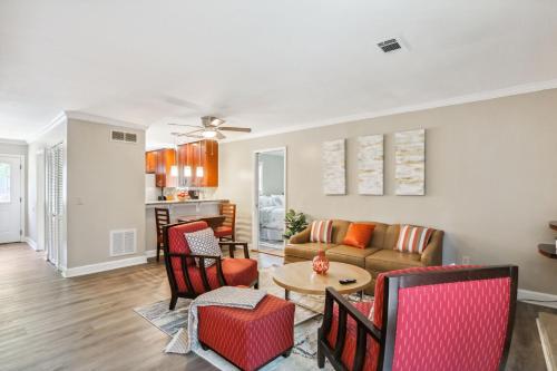 a living room with a couch and chairs and a table at Warm 2-Story Townhome in Smyrna