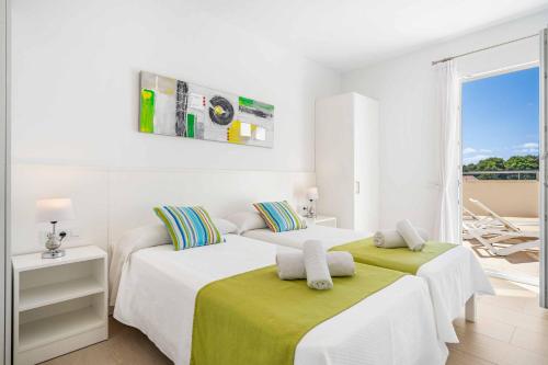 Postel nebo postele na pokoji v ubytování Agueda Menorca