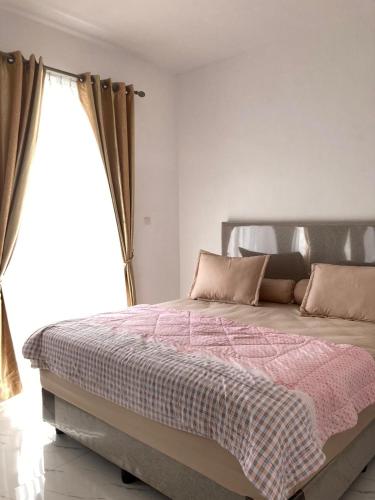 Postel nebo postele na pokoji v ubytování Sei Wampu Residence