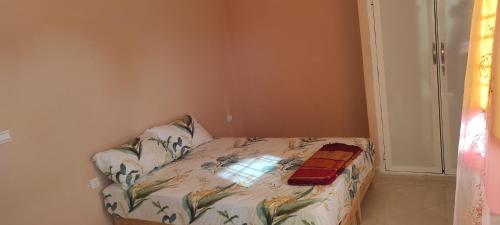 Кровать или кровати в номере Appartements de Vacances Près de la Plage Perle Bleue Saidia
