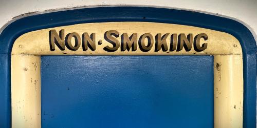 a sign that says non smoking on a blue wall at Heaven in the Hills Retreat in Maleny