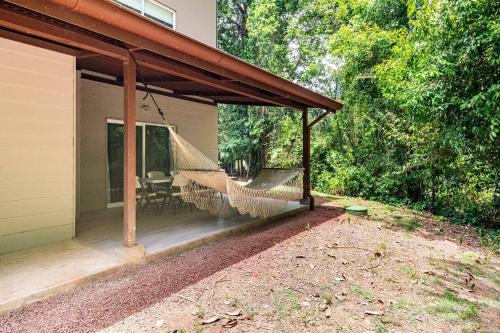 a screened in porch with a hammock on a house at Condo Playa Hermosa, Puntarenas in Muñeco