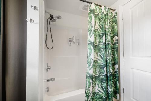 a bathroom with a shower with a shower curtain at Charming Family-Friendly 2 Bedroom 1 Bathroom Retreat Near Astoria & Beach in Warrenton