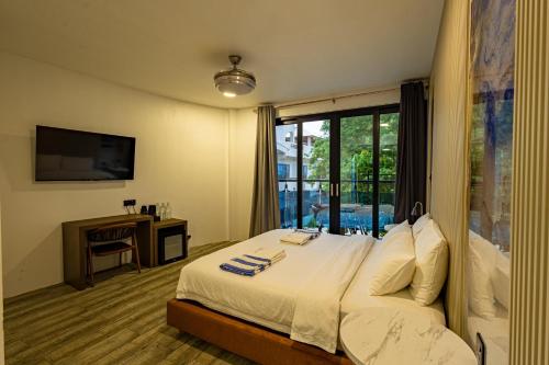 Cama o camas de una habitación en Bibee Maldives