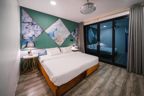 Cama o camas de una habitación en Bibee Maldives