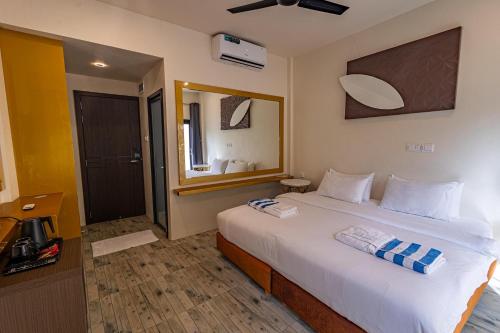 Cama o camas de una habitación en Bibee Maldives