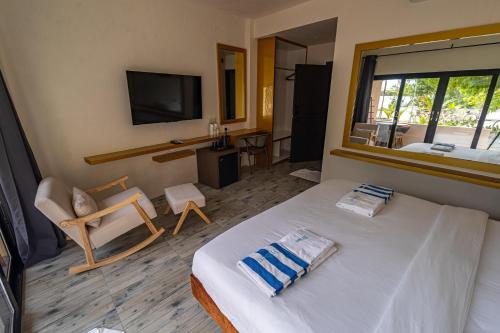 Cama o camas de una habitación en Bibee Maldives
