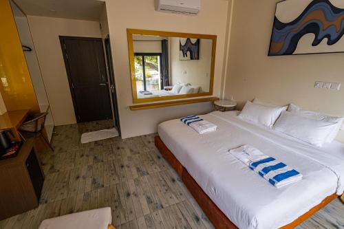 Cama o camas de una habitación en Bibee Maldives