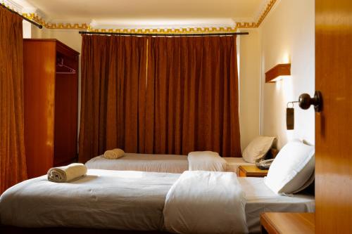 Ένα ή περισσότερα κρεβάτια σε δωμάτιο στο Hotel Ganesh Himal