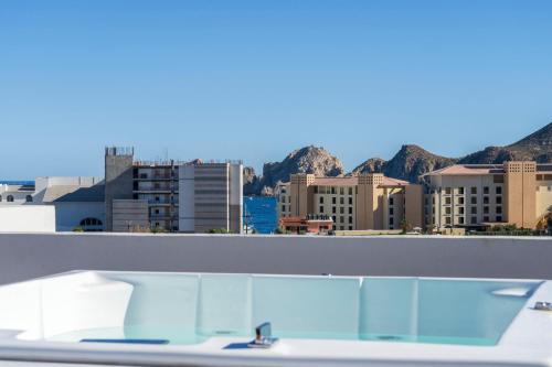 a view of a city from the roof of a building at Apartment with Private Rooftop in Medano in Cabo San Lucas