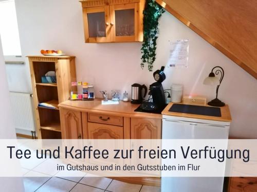 a kitchen with a sink and a stove top oven at Gut Weihersmühle in Leutershausen