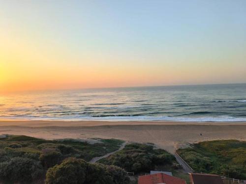 an aerial view of a beach at sunset at A Thin Slice of Heaven in Kingsburgh