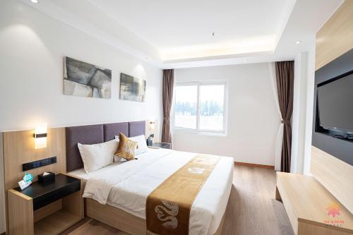 Postel nebo postele na pokoji v ubytování Hotel Miamor