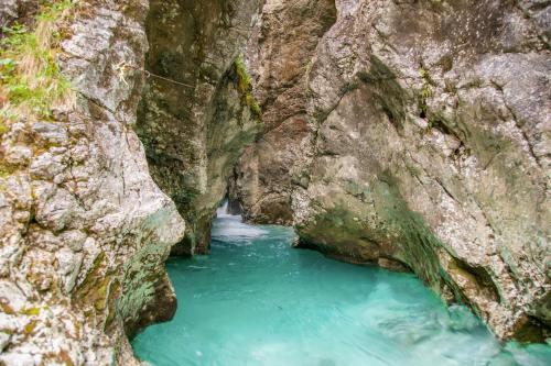 a river between two large rocks in a canyon at Retro house in Kamnik in Kamnik