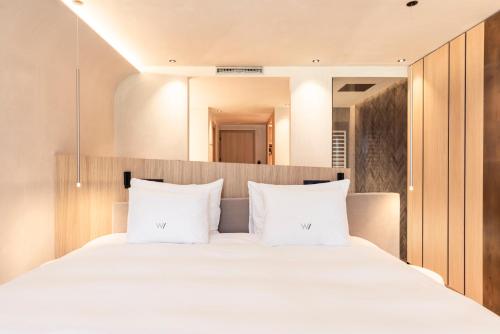 Ένα ή περισσότερα κρεβάτια σε δωμάτιο στο Hotel Winkler Sport & Spa Resort