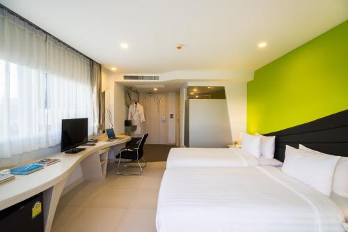 Katil atau katil-katil dalam bilik di Blue Boat Hotel JC