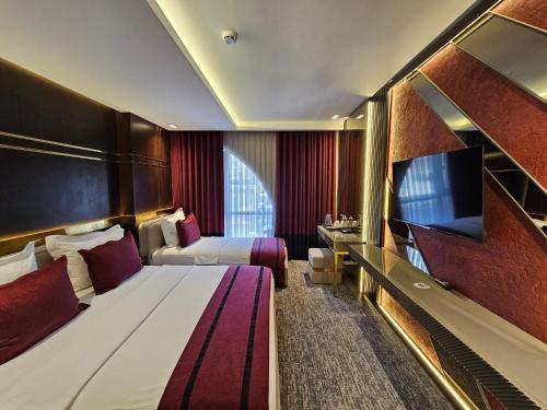 Televisyen dan/atau pusat hiburan di Asur Imperıal Hotel