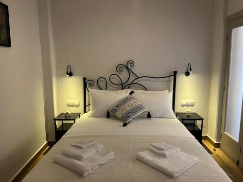 a bedroom with a bed with towels on it at Mirodaty's House in Rhodes Town