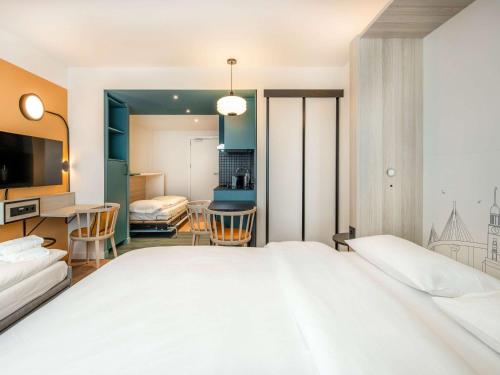 Ein Bett oder Betten in einem Zimmer der Unterkunft Aparthotel Adagio Access Porte de Camargue