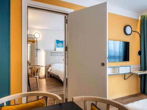 Ein Bett oder Betten in einem Zimmer der Unterkunft Aparthotel Adagio Access Porte de Camargue