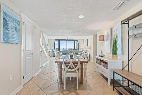 a dining room with a table and chairs at Perdido Towers West 307 in Perdido Key