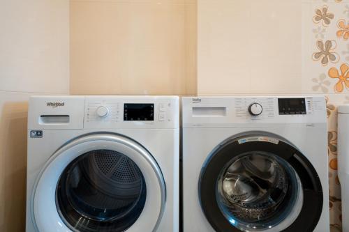 two washing machines sitting next to each other at Apollonian villa in Artemida