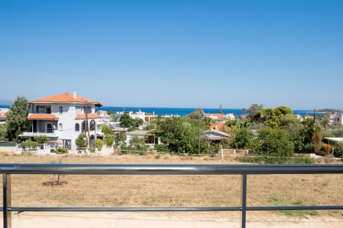 a view of a house from a balcony at Apollonian villa in Artemida