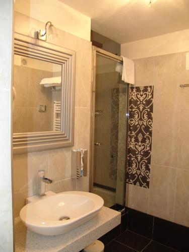 a bathroom with a sink and a shower at B&B Villa degli Aceri in Carcare