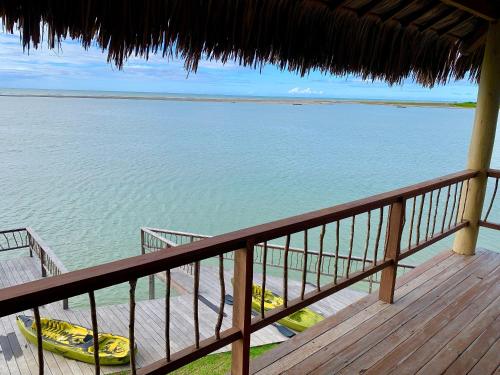 a view of the ocean from a balcony of a beach at Casa Caju Tatajuba in Tatajuba