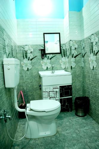 Un baño de MH Guest House