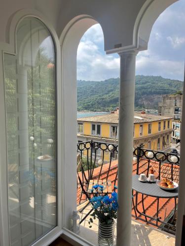 a view from a window of a balcony with a table at Le Finestre Veneris in Portovenere