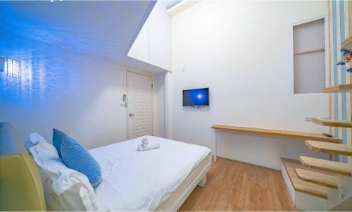 Postel nebo postele na pokoji v ubytování 羅東Vanilla 熊夜市包棟旅宿歡唱電動麻將燒烤皆可