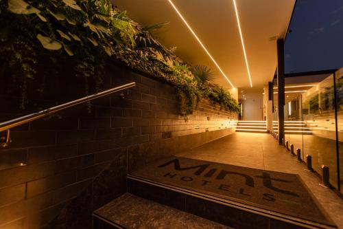 a walkway with plants on the side of a building at MINT Hotel 84 on Katherine in Johannesburg