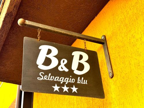 a sign hanging from a wall that says b subaya bus at B&B Selvaggio Blu in Baunei