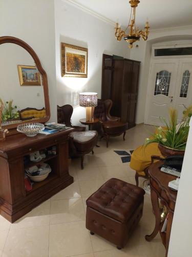 a living room with a vanity and a mirror at Luxury Apartman ZOGAN in Opatija