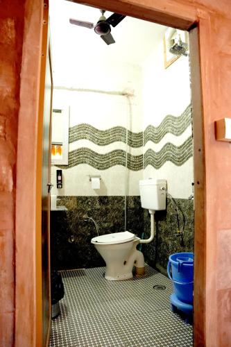 Un baño de MH Guest House