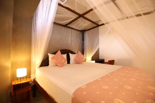 Ένα ή περισσότερα κρεβάτια σε δωμάτιο στο Chill Bay Weligama