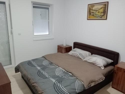 Postel nebo postele na pokoji v ubytování Apartman Petrovic 4