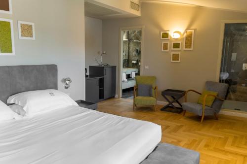 Кровать или кровати в номере Hotel Villa Paradiso